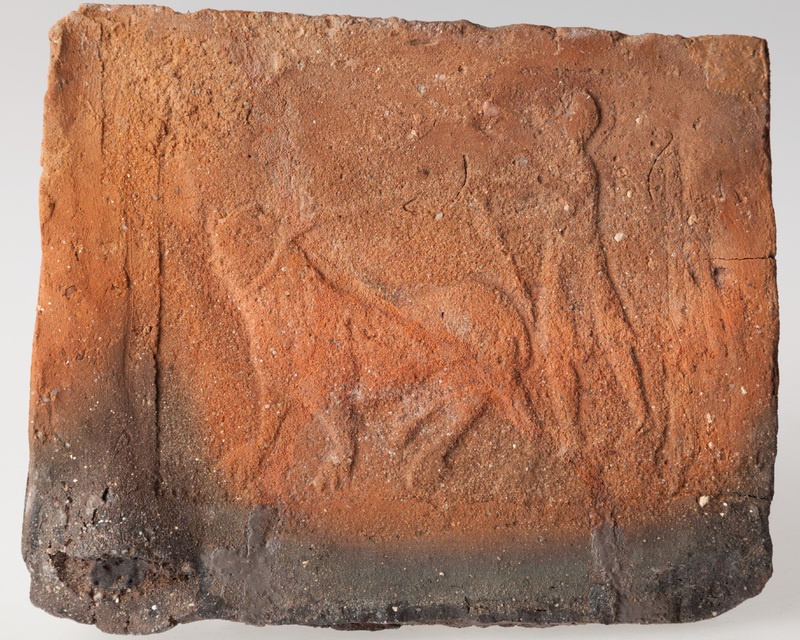 Płytka z wyobrażeniem człowieka prowadzącego byka na sznurze