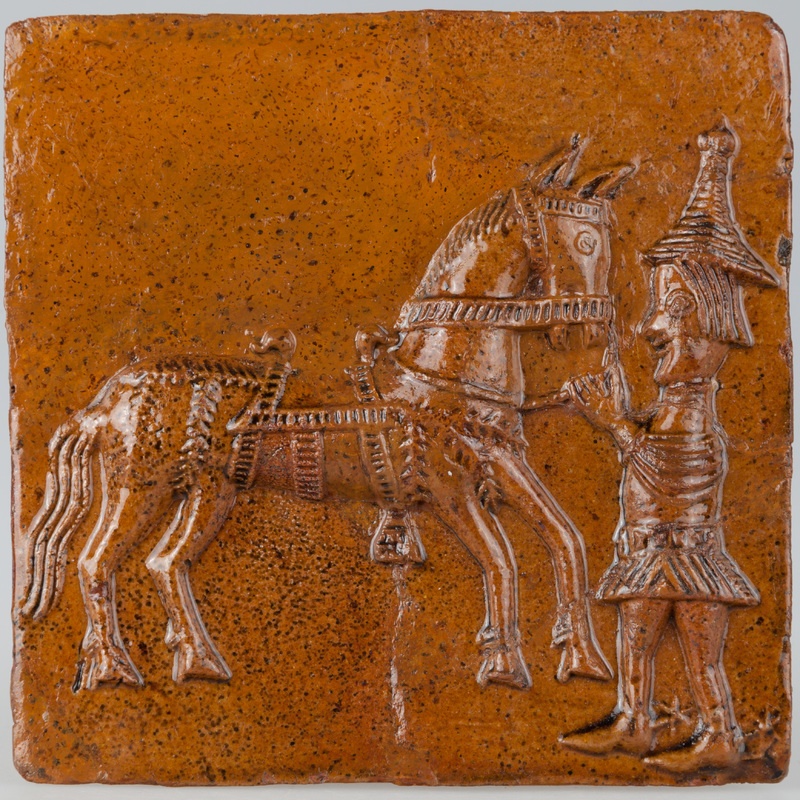 Kafel z giermkiem trzymającym konia