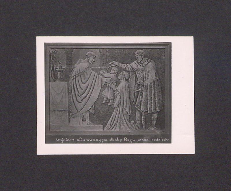 Płaskorzeźba ojca Efrema. Św. Wojciech ofiarowany na służbę Bogu przez rodziców.